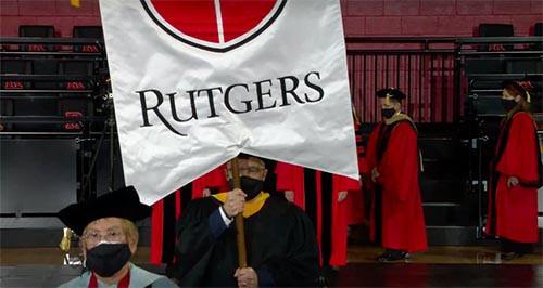 During the inauguration ceremony for Rutgers President Jonathan Holloway, Jon Oliver, who is assistant dean of information technology at SC&I and chair of the Rutgers University Senate, lead the procession to the stage, while carrying the Rutgers Gonfalon, an honor bestowed upon him as chair of the senate. 