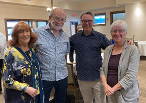 Three deans and Jenny Mandelbaum at party 