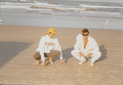 Ed Harran, to the left, wearing the Rutgers sweatshirt and yellow hat.