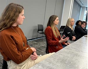 On Friday November 11, at the Rutgers University Rodkin Academic Center, SC&I faculty and students gathered for the “Women in Business” panel. The goal of the event was to empower female student-athletes in attendance who intend to enter male-dominated business fields. The panelists were SC&I alumnae who majored in Communication, were on the Rutgers women’s tennis, rowing, or lacrosse teams, and have built successful careers in marketing.   The panel was hosted by Rutgers Women’s Tennis Coach Hilary Ritchie, Assistant Athletic Director Carissa Conroy, and SC&I Assistant Professor of Professional Practice, Communication Mark Beal.   Beal said providing the student-athletes with the chance to meet and learn from successful SC&I alums is beneficial because Gen Z employees aspire to be heard and valued by the organizations they work for. He said, “They are looking to receive opportunities to demonstrate their thought leadership and their strategic and creative approach to problem solving and not simply just completing tasks. Today’s entry-level executives, Gen Z, have an innovative entrepreneurial mindset. Empowering Gen Z includes inviting them to exercise this mindset to develop transformative ideas, initiatives, and programs."  Over 30 current SC&I student-athletes on the women’s lacrosse, tennis, and softball teams attended. Courtney Wilde, a senior who is double majoring in Communication and Journalism and Media Studies and a softball player, was one of the students present. As she is expected to graduate in May 2023, Wilde said the panel provided her with useful advice as she starts to apply for post-graduate jobs. “I was so inspired. The panelists gave me new ideas to think about from a career standpoint,” she said. Photo 2  Panelists included Lindsay Balsamo COM’15, Vailey Eberhard COM’18, Monica Dresnin COM’20, Maya Jacobs COM’21, and Grace Lewis COM’21. The panelists shared career experiences, insight, lessons learned, and advice.  Balsamo, former captain of the Women’s Tennis team and current NBC Universal